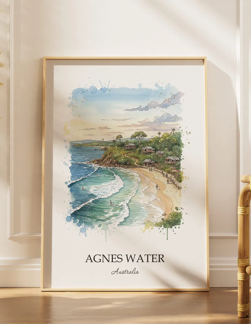 A gorgeous boho-inspired living space with a framed vintage travel poster of Agnes Water in Australia on display.