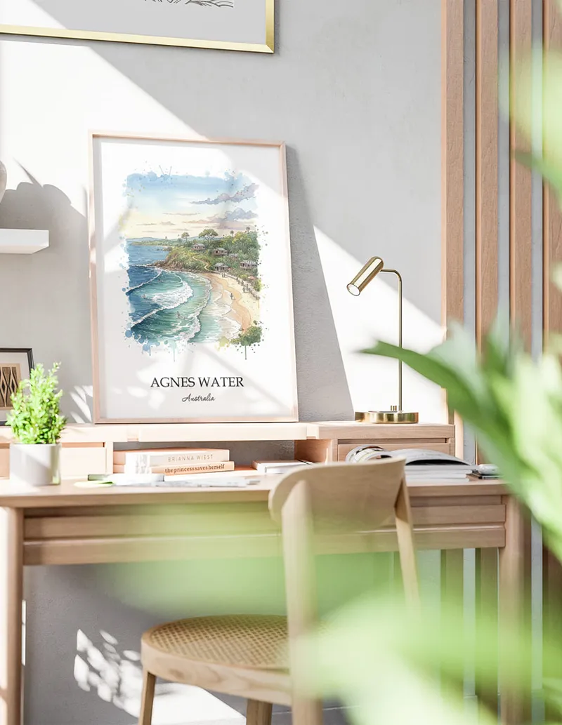 Minimalist poster of Agnes Water in Australia in a light frame standing by a window in a boho style room.