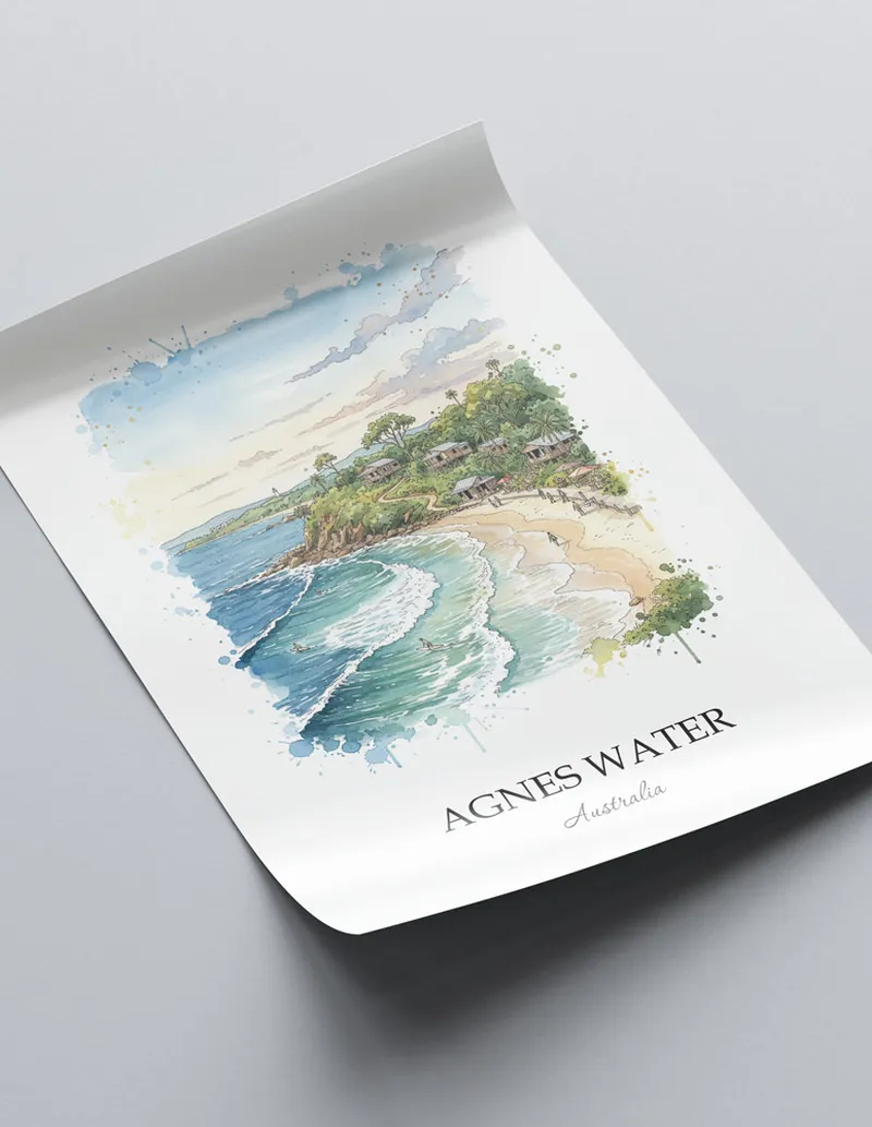 Vintage travel poster of Agnes Water, Australia in a light frame displayed above a sofa in a bright boho interior.