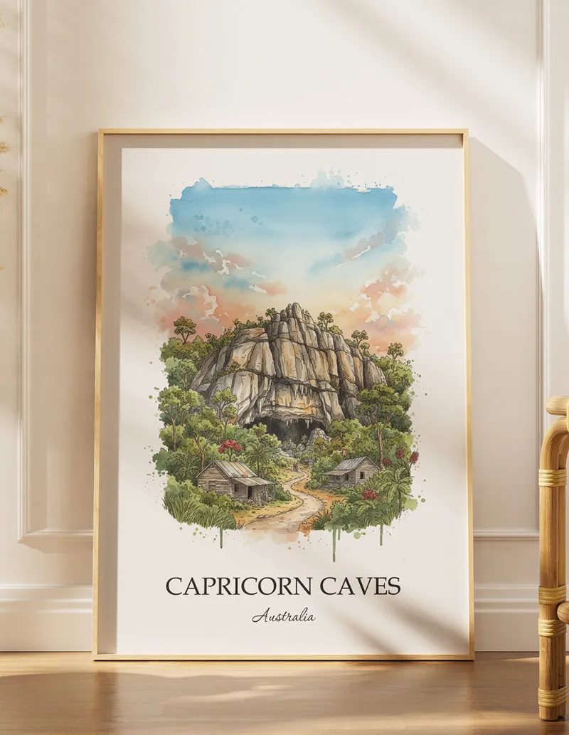 A gorgeous boho-inspired living space with a framed vintage travel poster of Capricorn Caves in Australia on display.