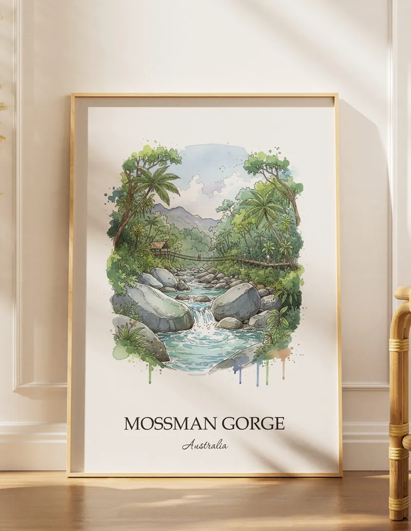A gorgeous boho-inspired living space with a framed vintage travel poster of Mossman Gorge in Australia on display.
