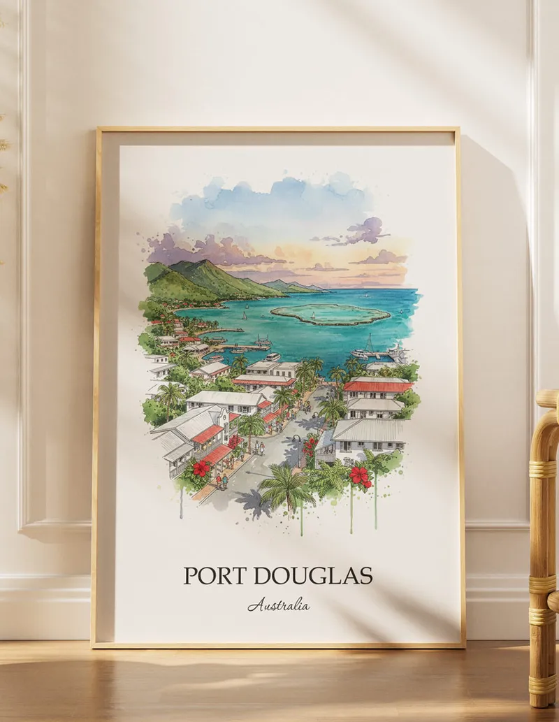 A gorgeous boho-inspired living space with a framed vintage travel poster of Port Douglas in Australia on display.