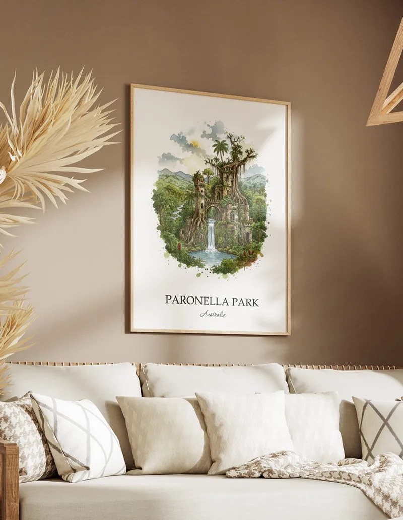 Minimalist poster of Paronella Park in Australia in a light frame standing on the floor in a dark moody interior.