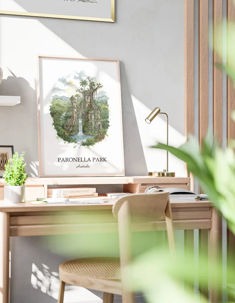 Minimalist poster of Paronella Park in Australia in a light frame standing by a window in a boho style room.