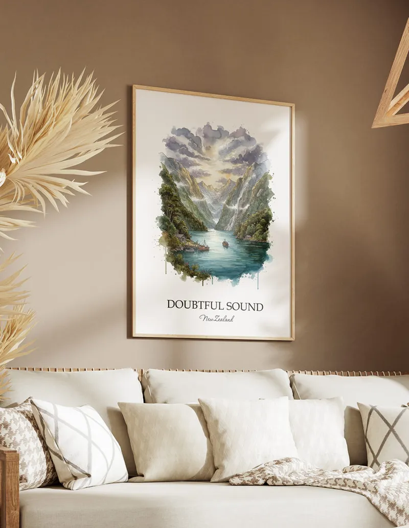 Minimalist poster of Doubtful Sound in New Zealand in a light frame standing on the floor in a dark moody interior.