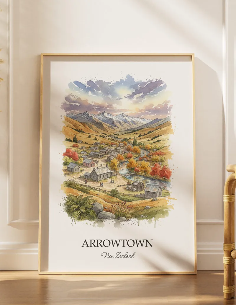 A gorgeous boho-inspired living space with a framed vintage travel poster of Arrowtown in New Zealand on display.
