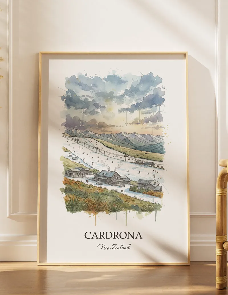 A gorgeous boho-inspired living space with a framed vintage travel poster of Cardrona in New Zealand on display.