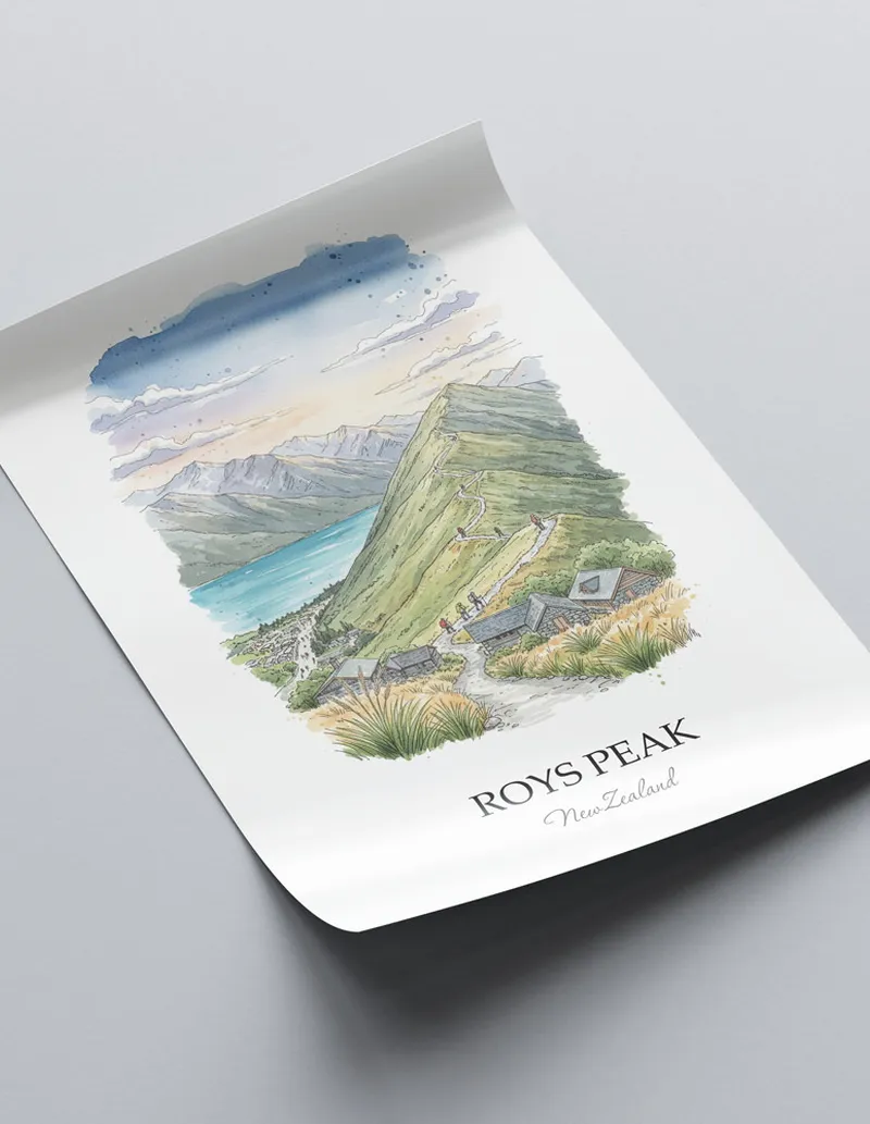 Vintage travel poster of Roys Peak, New Zealand in a light frame displayed above a sofa in a bright boho interior.