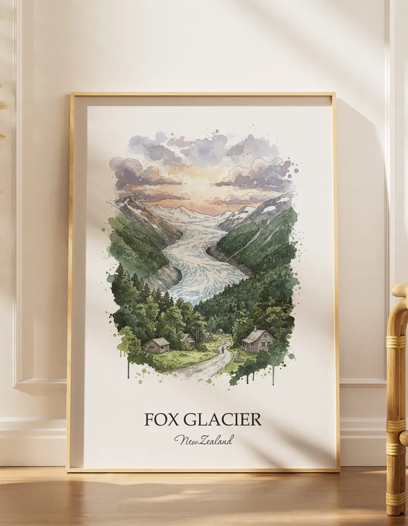 A gorgeous boho-inspired living space with a framed vintage travel poster of Fox Glacier in New Zealand on display.