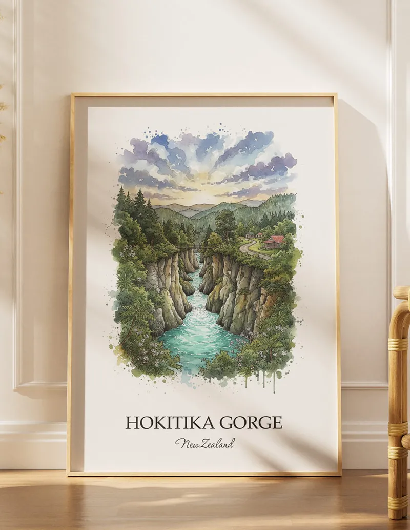 A gorgeous boho-inspired living space with a framed vintage travel poster of Hokitika Gorge in New Zealand on display.
