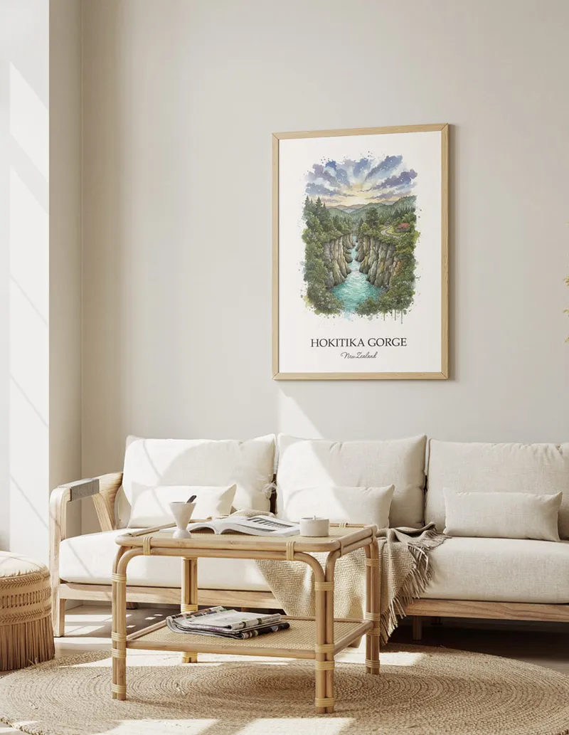 Framed wall art featuring Hokitika Gorge in New Zealand in a light wood frame leaning on the floor.