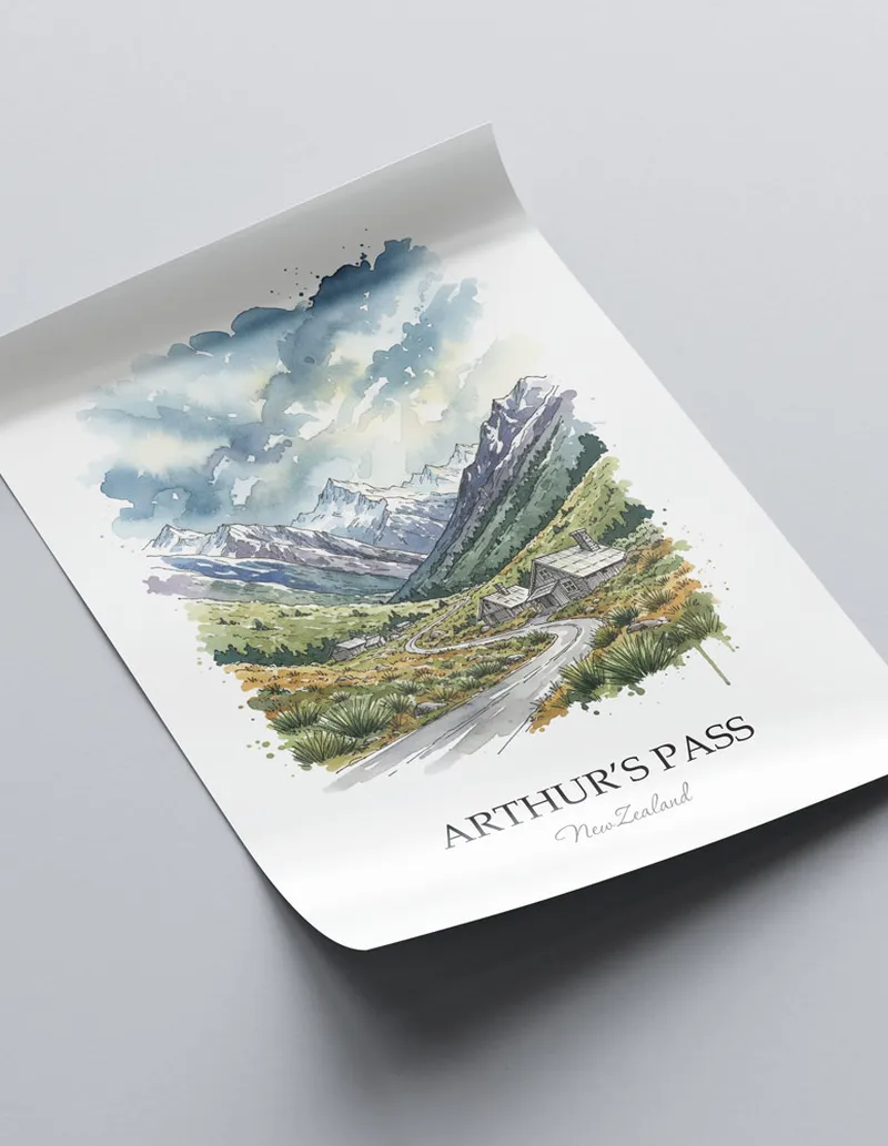 Vintage travel poster of Arthur's Pass, New Zealand in a light frame displayed above a sofa in a bright boho interior.