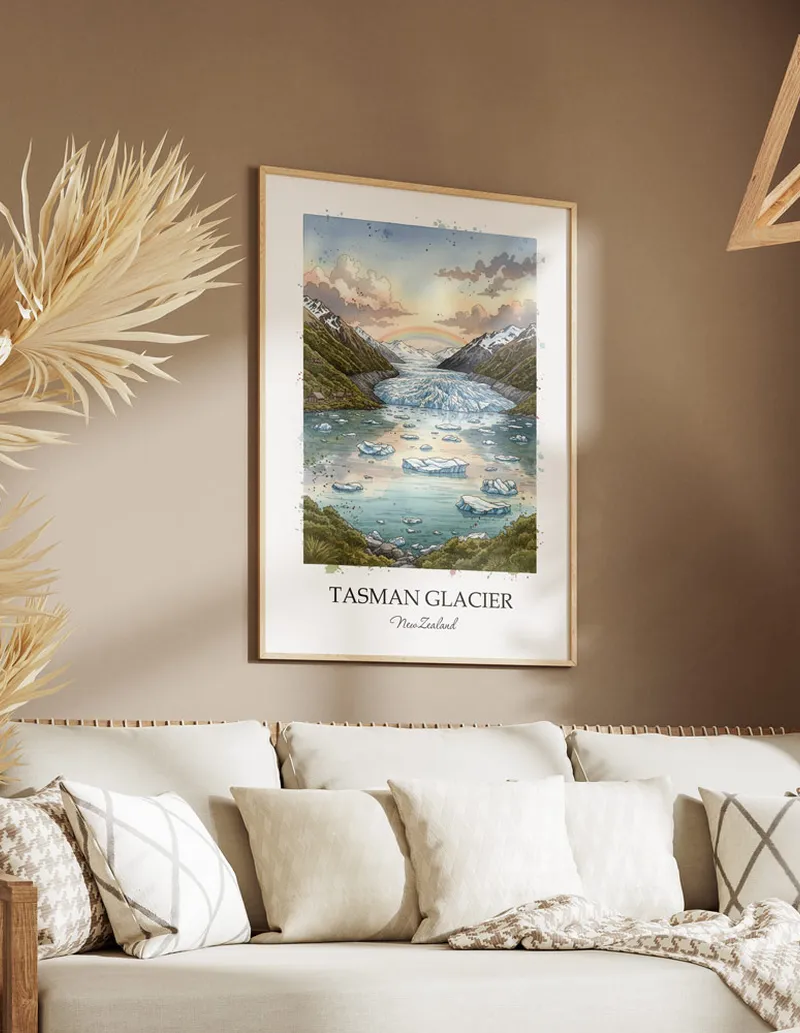 Minimalist poster of Tasman Glacier in New Zealand in a light frame standing on the floor in a dark moody interior.