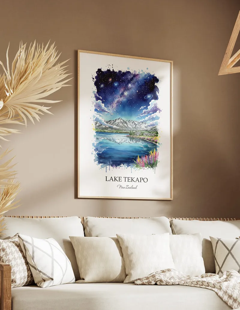 Minimalist poster of Lake Tekapo in New Zealand in a light frame standing on the floor in a dark moody interior.