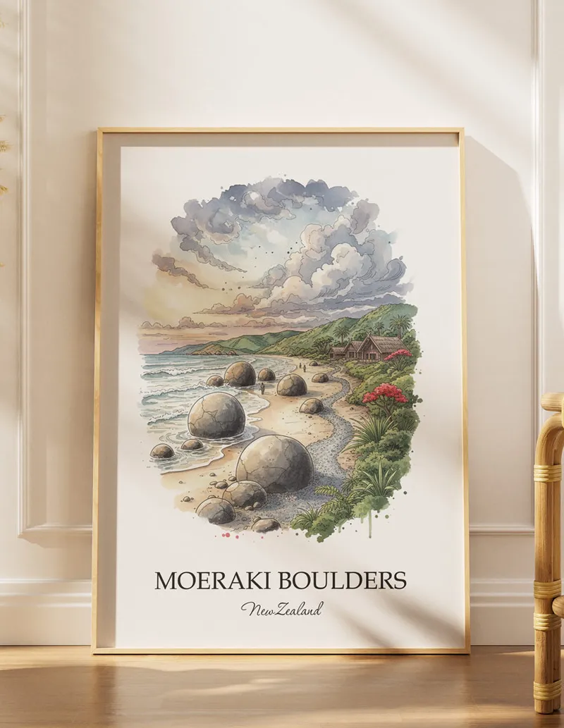 A gorgeous boho-inspired living space with a framed vintage travel poster of Moeraki Boulders in New Zealand on display.