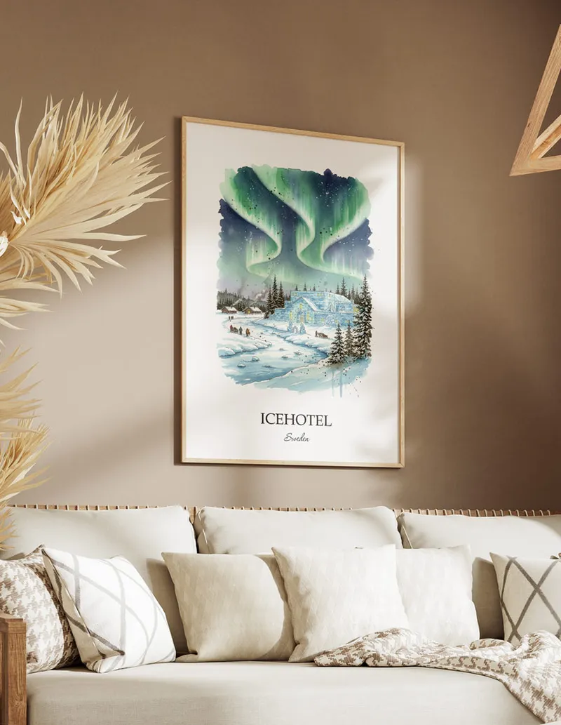 Vintage travel poster of Icehotel, Sweden in a light frame displayed above a sofa in a bright boho interior.