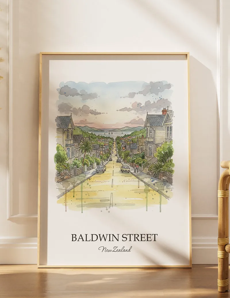 A gorgeous boho-inspired living space with a framed vintage travel poster of Baldwin Street in New Zealand on display.