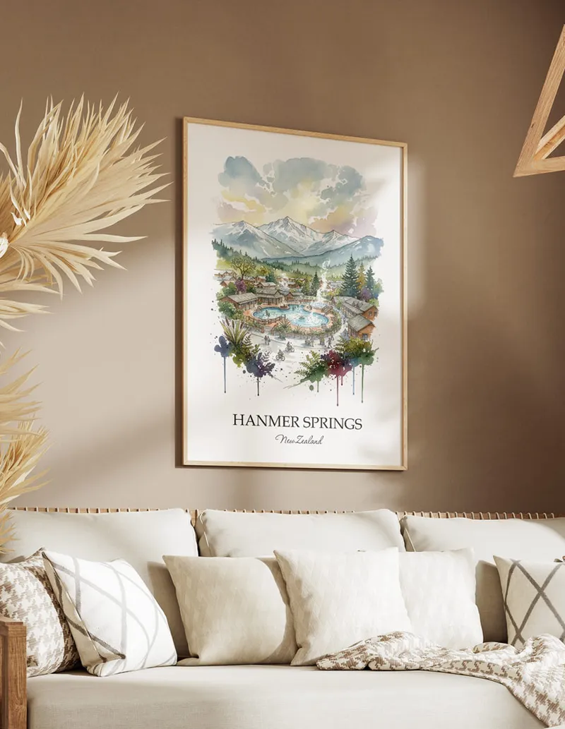 Minimalist poster of Hanmer Springs in New Zealand in a light frame standing on the floor in a dark moody interior.