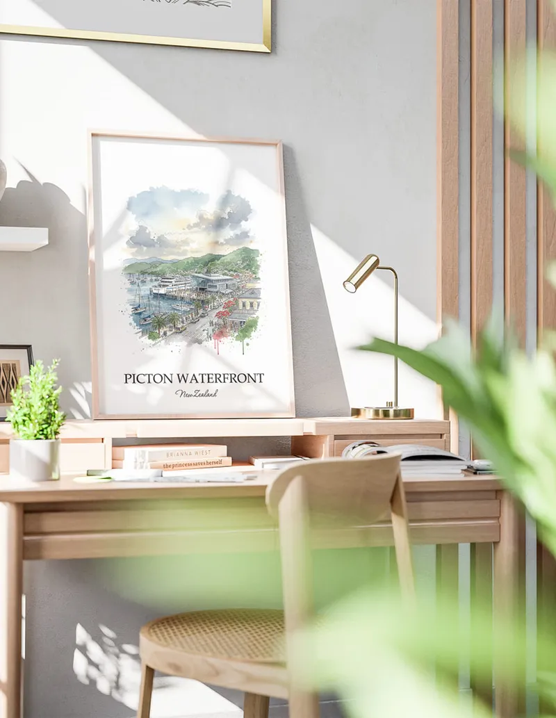 Minimalist poster of Picton Waterfront in New Zealand in a light frame standing by a window in a boho style room.