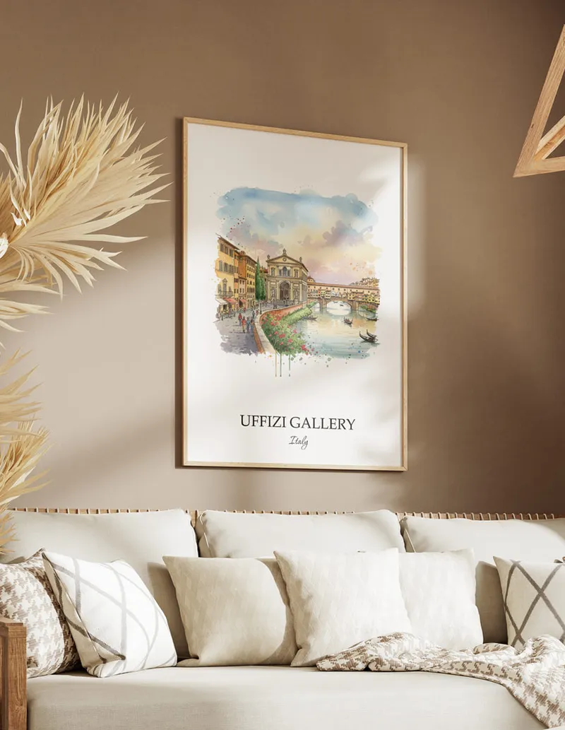 Vintage travel poster of Uffizi Gallery, Italy in a light frame displayed above a sofa in a bright boho interior.