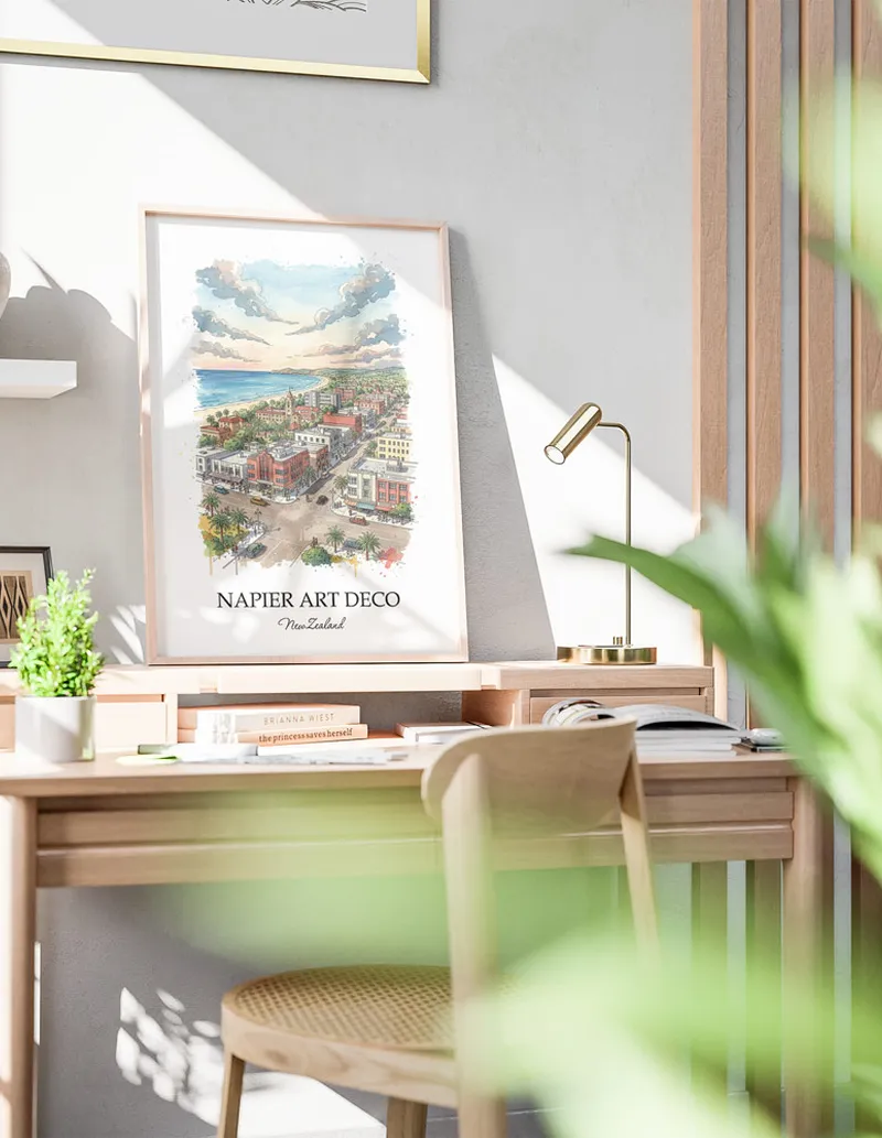 Minimalist poster of Napier Art Deco in New Zealand in a light frame standing by a window in a boho style room.