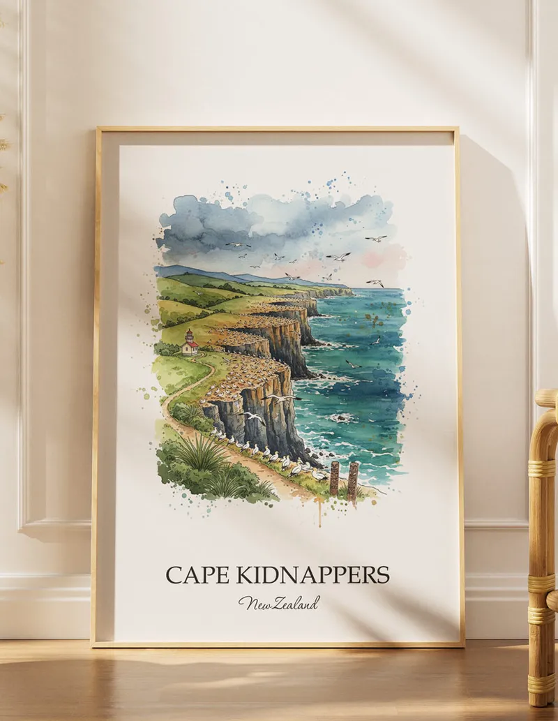 A gorgeous boho-inspired living space with a framed vintage travel poster of Cape Kidnappers in New Zealand on display.