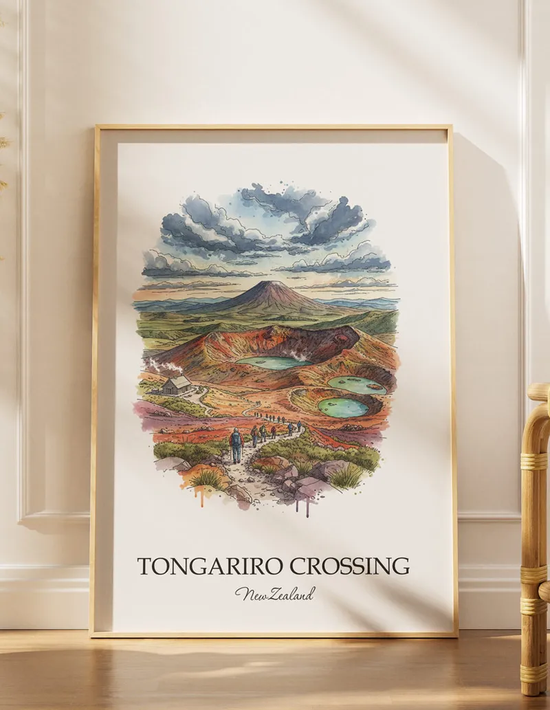 A gorgeous boho-inspired living space with a framed vintage travel poster of Tongariro Crossing in New Zealand on display.