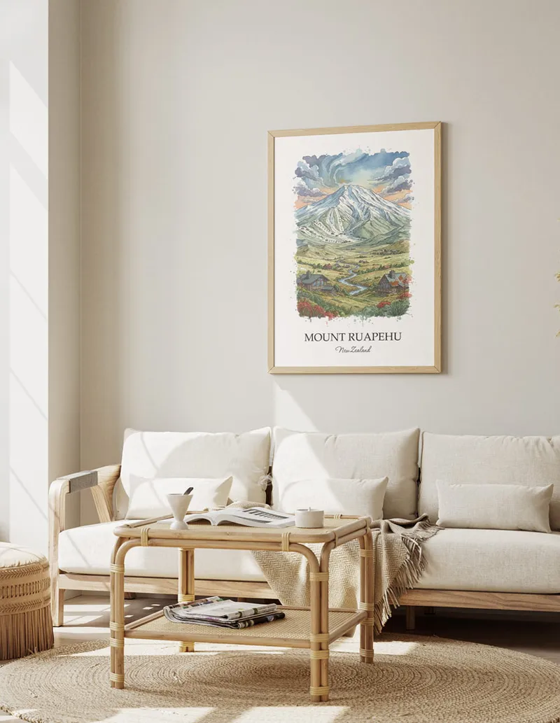 Framed wall art featuring Mount Ruapehu in New Zealand in a light wood frame leaning on the floor.