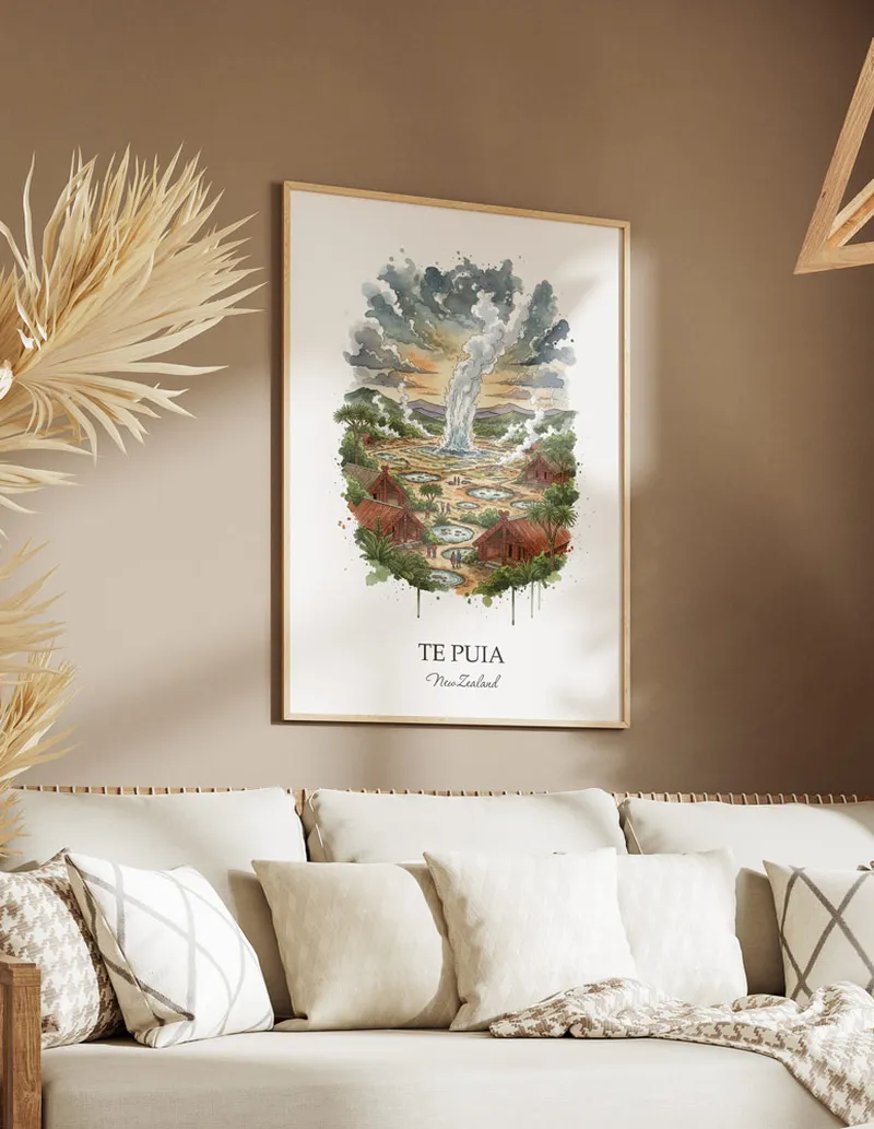 Minimalist poster of Te Puia in New Zealand in a light frame standing on the floor in a dark moody interior.