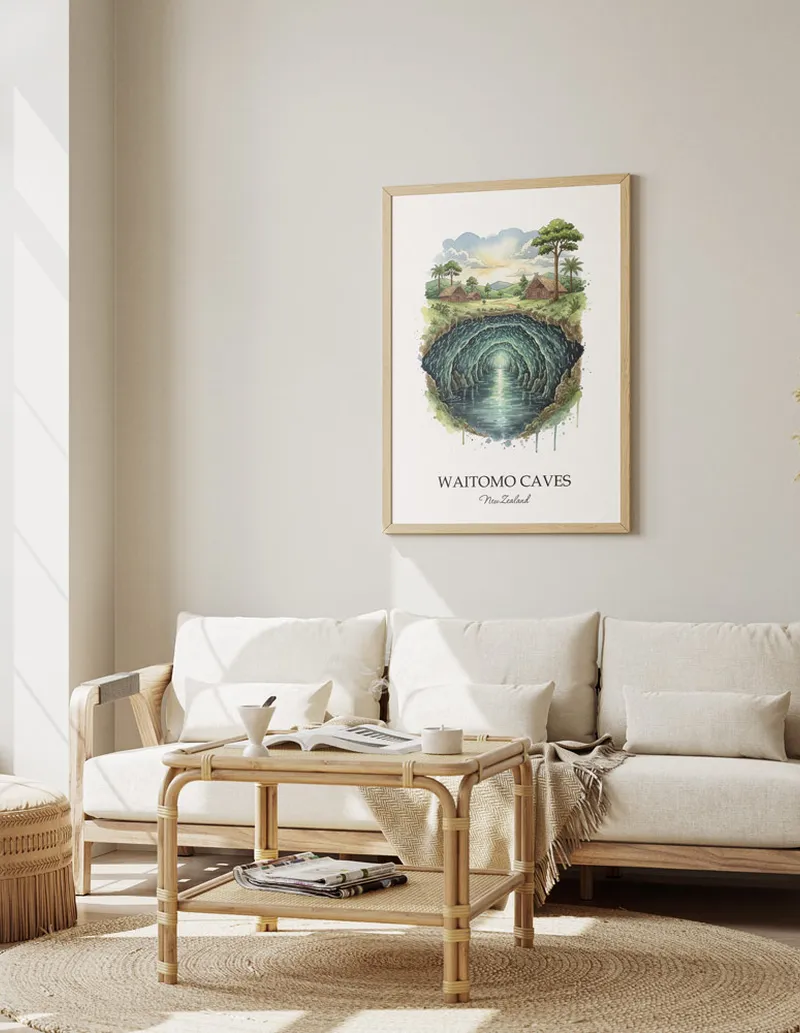 Framed wall art featuring Waitomo Caves in New Zealand in a light wood frame leaning on the floor.
