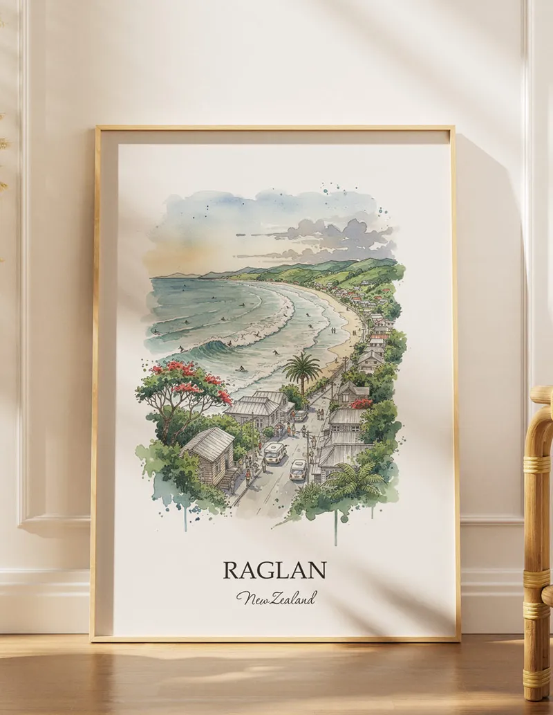 A gorgeous boho-inspired living space with a framed vintage travel poster of Raglan in New Zealand on display.
