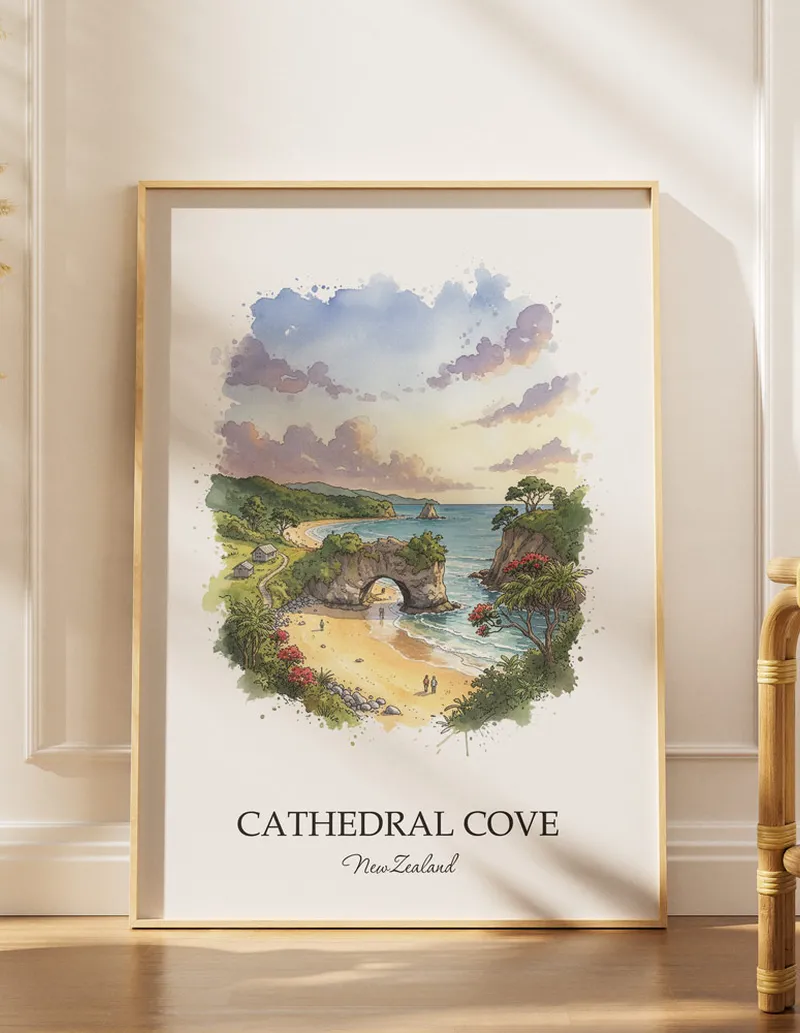 A gorgeous boho-inspired living space with a framed vintage travel poster of Cathedral Cove in New Zealand on display.