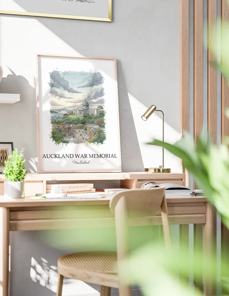 Minimalist poster of Auckland War Memorial in New Zealand in a light frame standing by a window in a boho style room.