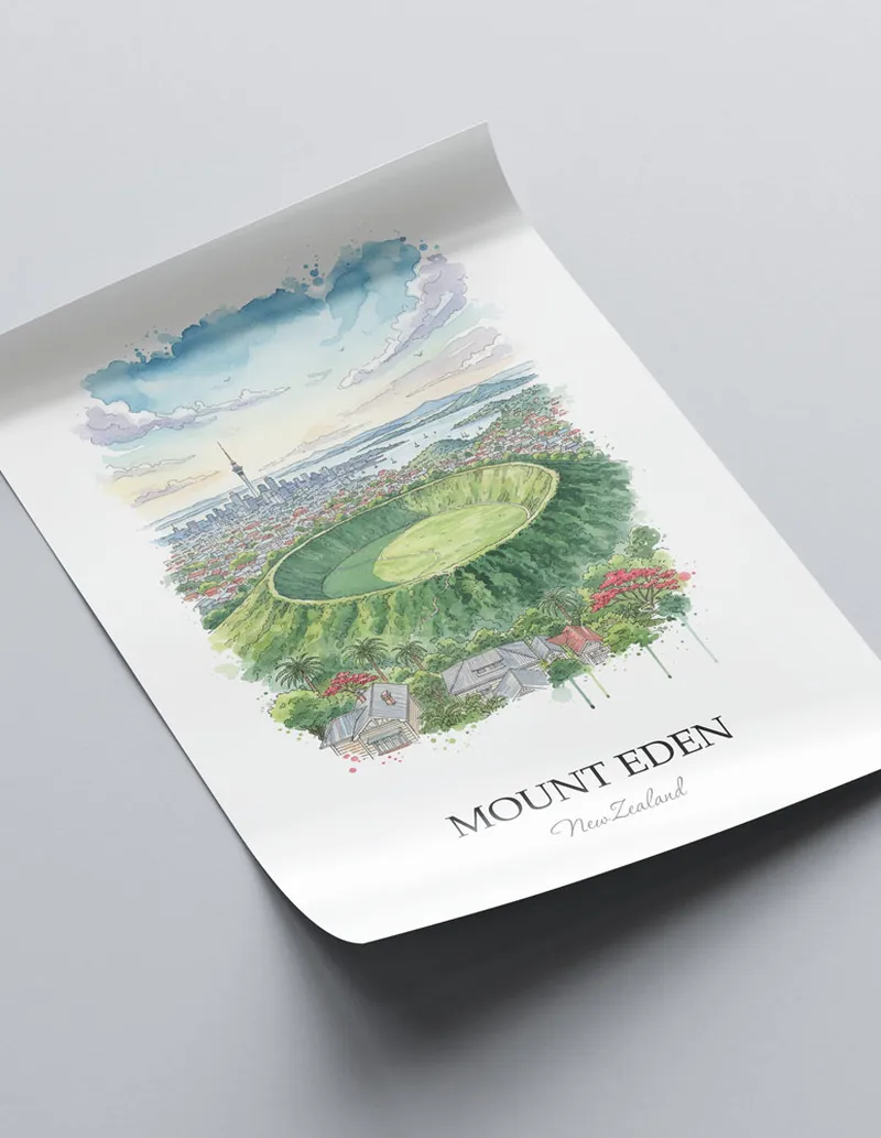 Vintage travel poster of Mount Eden, New Zealand in a light frame displayed above a sofa in a bright boho interior.