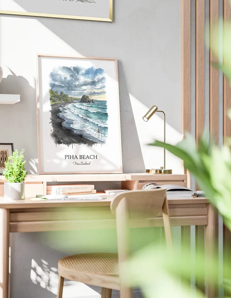 Minimalist poster of Piha Beach in New Zealand in a light frame standing by a window in a boho style room.