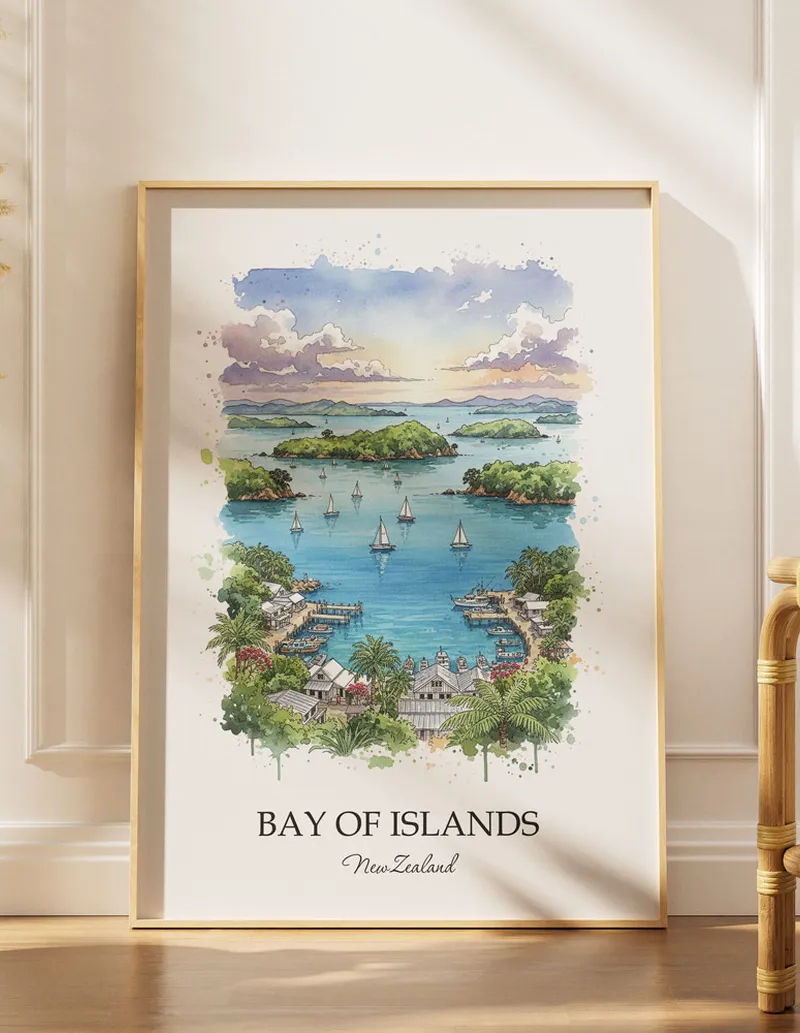 A gorgeous boho-inspired living space with a framed vintage travel poster of Bay of Islands in New Zealand on display.
