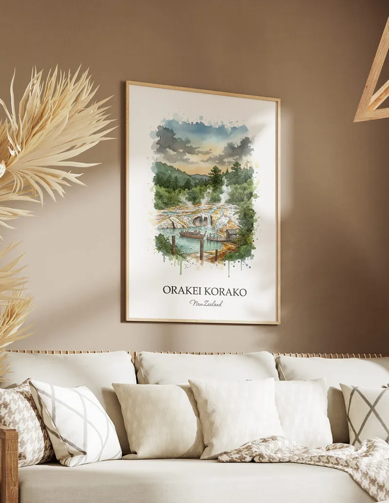 Minimalist poster of Orakei Korako in New Zealand in a light frame standing on the floor in a dark moody interior.