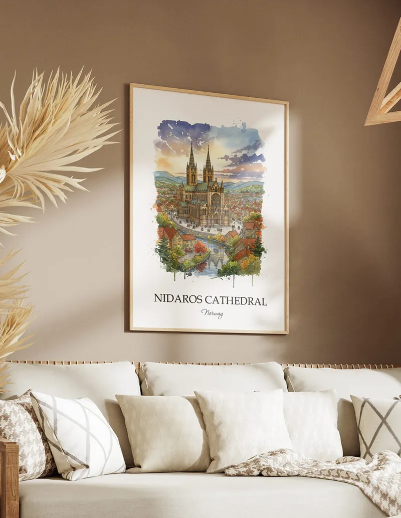 Vintage travel poster of Nidaros Cathedral, Norway in a light frame displayed above a sofa in a bright boho interior.
