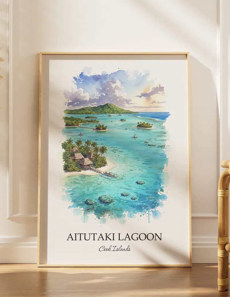 Cozy, well-lit workspace with a minimalist poster of Aitutaki Lagoon, Cook Islands in a light frame sitting on the desk.