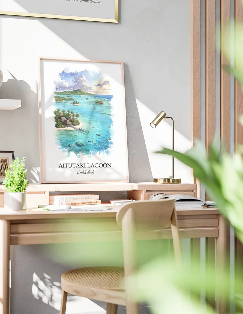 Framed wall art featuring Aitutaki Lagoon, Cook Islands in a light wood frame hanging above a sofa in a modern living room.