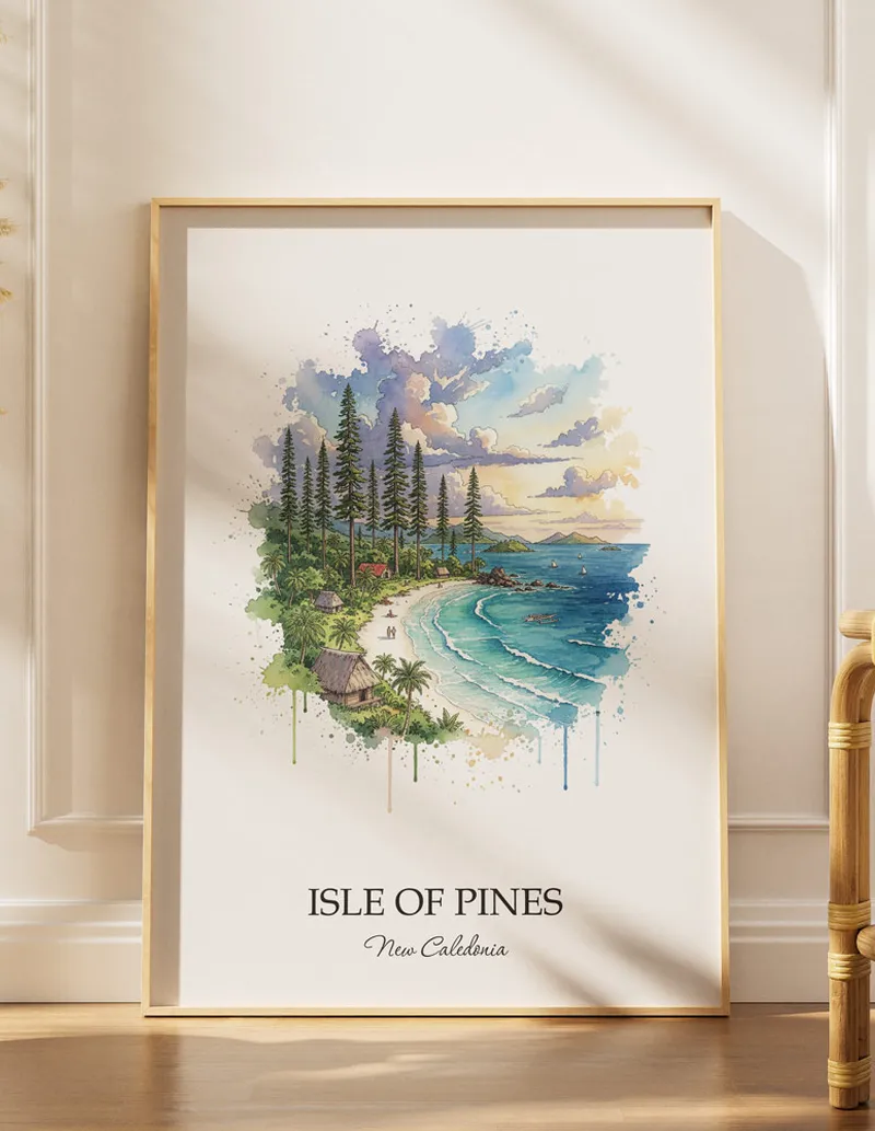 Cozy, well-lit workspace with a minimalist poster of Isle of Pines, New Caledonia in a light frame sitting on the desk.