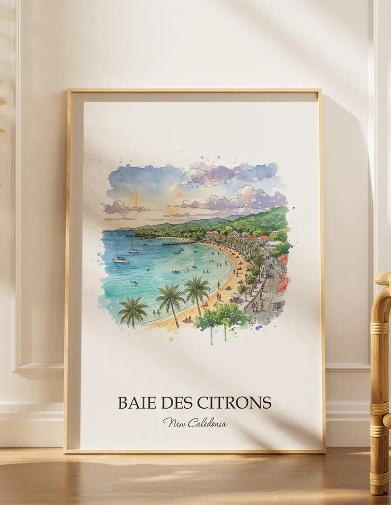 Cozy, well-lit workspace with a minimalist poster of Baie des Citrons, New Caledonia in a light frame sitting on the desk.
