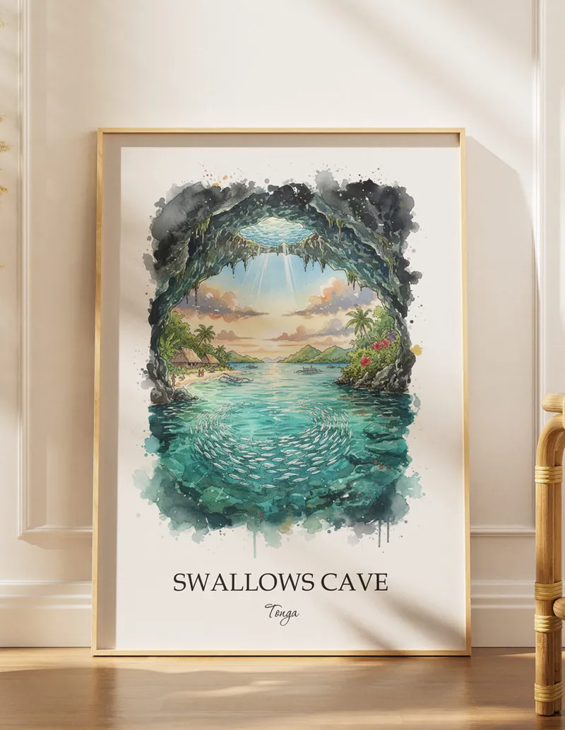 Cozy, well-lit workspace with a minimalist poster of Swallows Cave, Tonga in a light frame sitting on the desk.