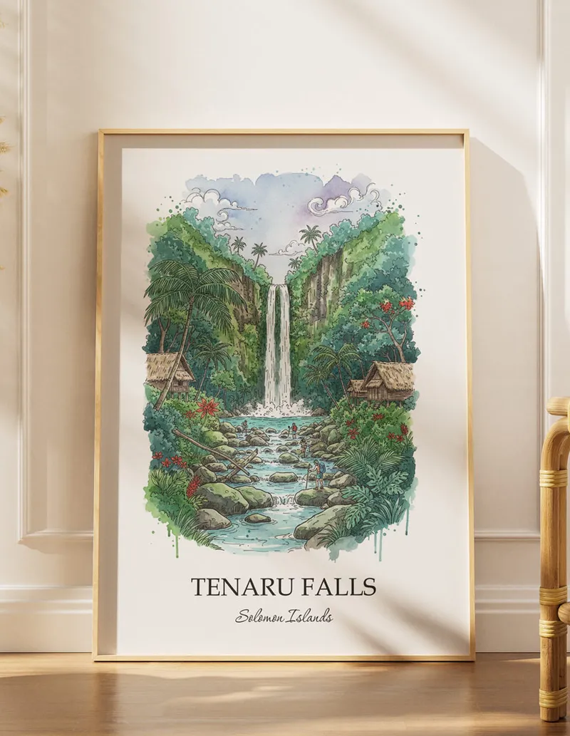 Cozy, well-lit workspace with a minimalist poster of Tenaru Falls, Solomon Islands in a light frame sitting on the desk.