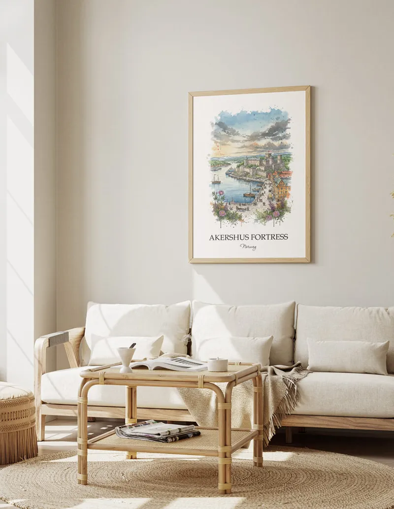 Framed wall art featuring Akershus Fortress, Norway in a light wood frame hanging above a sofa in a modern living room.