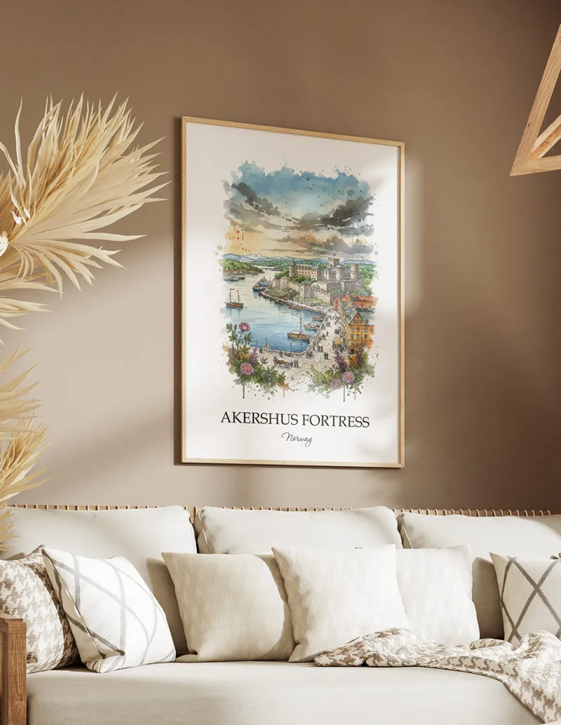 Vintage travel poster of Akershus Fortress, Norway in a light frame displayed above a sofa in a bright boho interior.