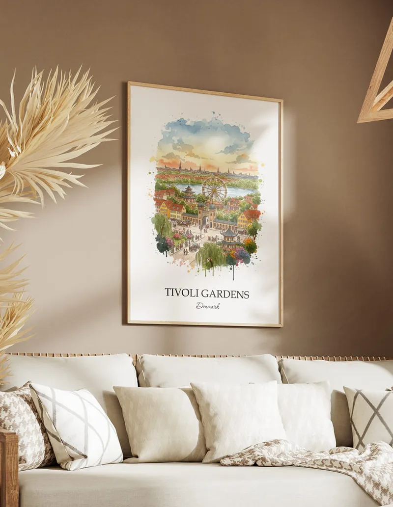 Vintage travel poster of Tivoli Gardens, Denmark in a light frame displayed above a sofa in a bright boho interior.