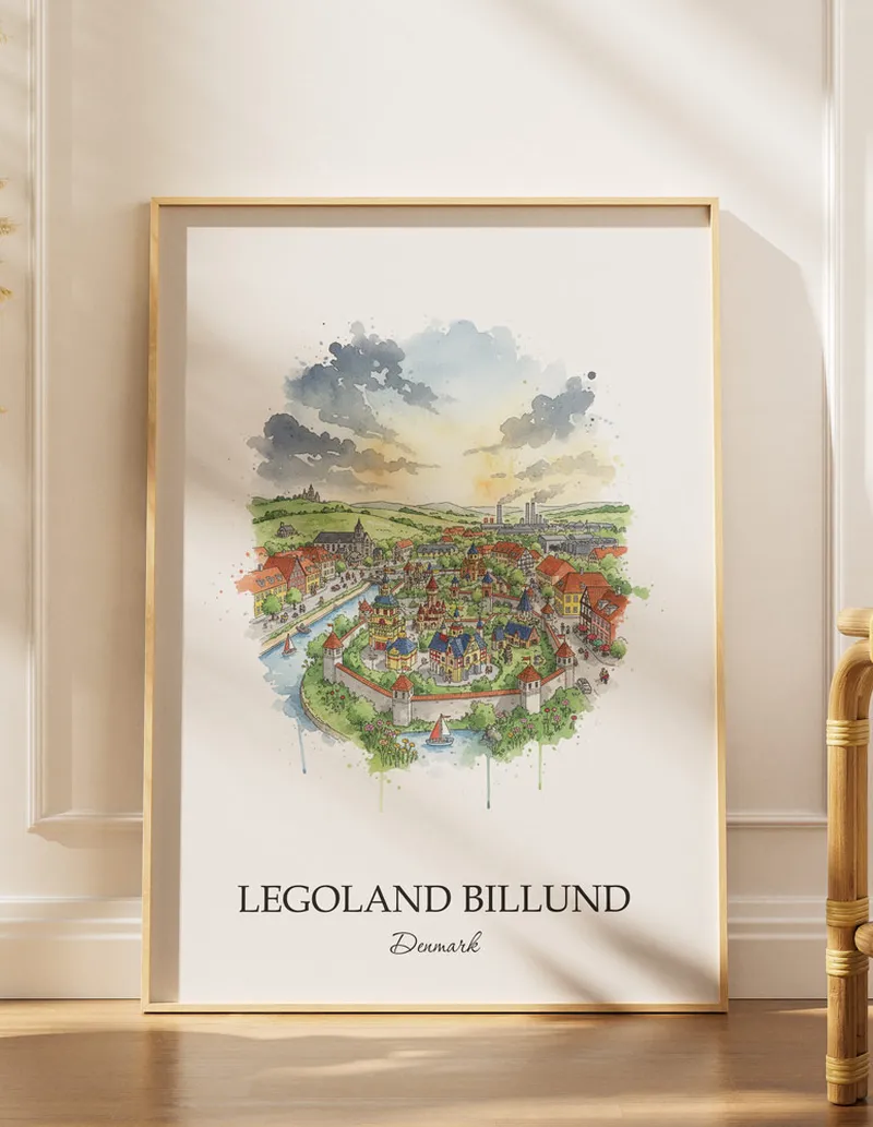 Framed wall art featuring Legoland Billund in Denmark in a light wood frame leaning on the floor.