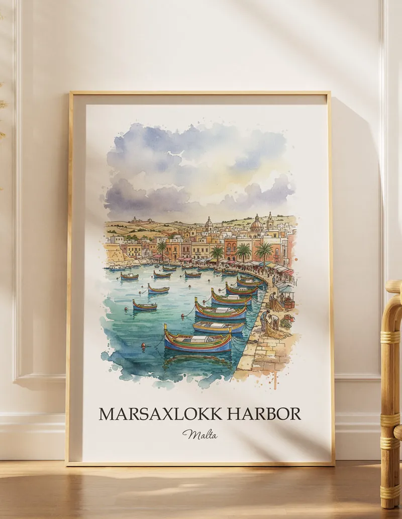 Framed wall art featuring Marsaxlokk Harbor in Malta in a light wood frame leaning on the floor.
