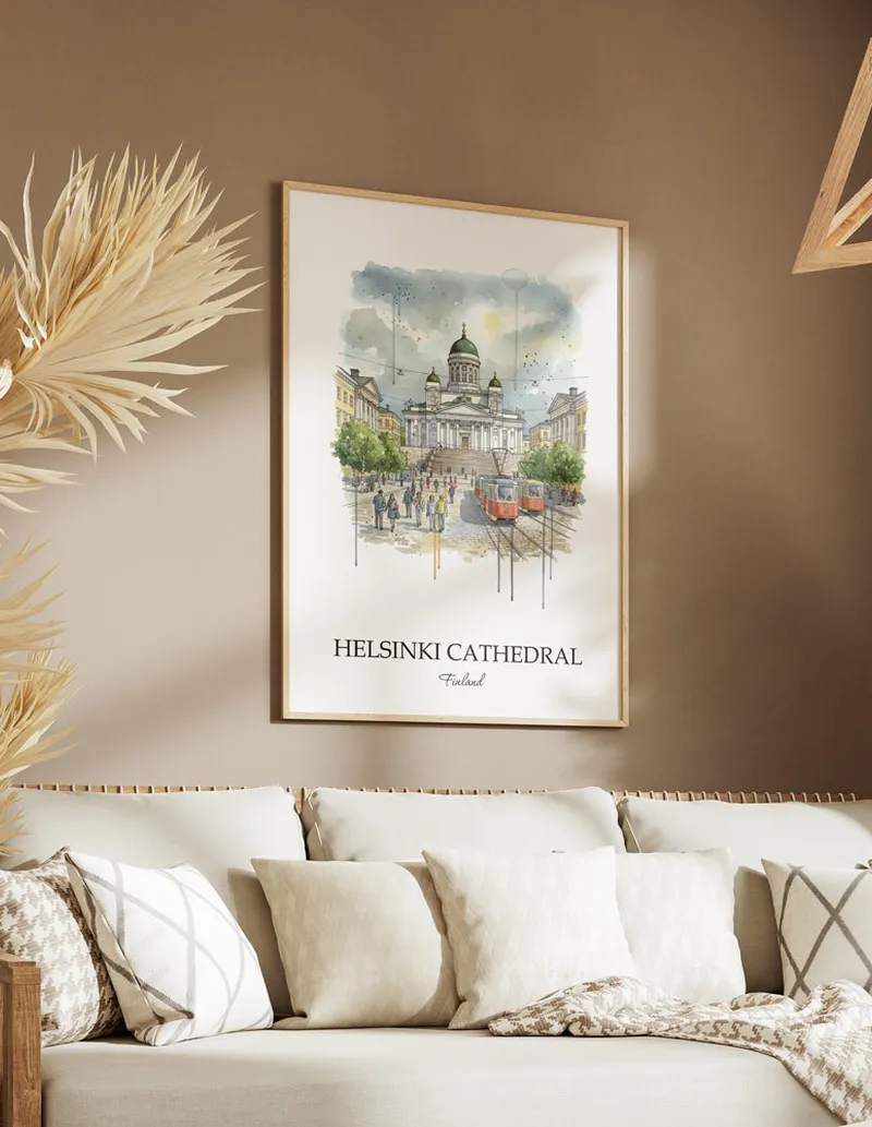 Vintage travel poster of Helsinki Cathedral, Finland in a light frame displayed above a sofa in a bright boho interior.